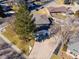 Aerial view of the property showing the roof, driveway, and surrounding landscaping in a residential neighborhood at 6111 W Fremont Dr, Littleton, CO 80128