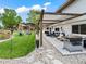 Inviting backyard patio with grilling area, outdoor seating, and a pergola, perfect for entertaining and enjoying outdoor living at 6111 W Fremont Dr, Littleton, CO 80128