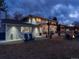 Outdoor space with patio, pergola with string lights, seating and fire pit create a relaxing backyard retreat at 6111 W Fremont Dr, Littleton, CO 80128