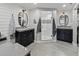 Spa-like bathroom showcasing dual vanities, tiled floors, and a glass shower with tile accents at 6111 W Fremont Dr, Littleton, CO 80128