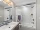 Modern bathroom showcasing a frosted glass shower door, sleek vanity, and contemporary fixtures for a spa-like experience at 6111 W Fremont Dr, Littleton, CO 80128