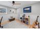 Multi-purpose room with neutral colors, area rug, guitar and storage shelf at 6111 W Fremont Dr, Littleton, CO 80128