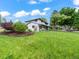 Beautifully landscaped front yard highlighting a well-maintained two-story home on a lush green lawn at 6111 W Fremont Dr, Littleton, CO 80128