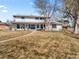 Exterior daytime view of a charming two-story home with a well-maintained lawn at 6111 W Fremont Dr, Littleton, CO 80128