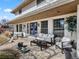 Inviting front porch with comfortable seating, plants, and double blue doors at 6111 W Fremont Dr, Littleton, CO 80128