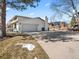 Spacious three car garage with ample storage space and large driveway at 6111 W Fremont Dr, Littleton, CO 80128