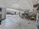 Spacious garage with an open door reveals ample storage for vehicles and outdoor equipment, providing convenience and organization at 6111 W Fremont Dr, Littleton, CO 80128