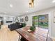 Bright and airy living space with open layout, seamlessly connecting the living room and dining area at 6111 W Fremont Dr, Littleton, CO 80128
