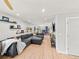 Spacious living room featuring hardwood floors, modern decor, and an open layout for seamless entertaining at 6111 W Fremont Dr, Littleton, CO 80128