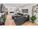 Comfortable living room featuring a large sectional sofa, stylish decor, and a cozy fireplace at 6111 W Fremont Dr, Littleton, CO 80128
