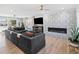 Inviting living room with a stylish fireplace, hardwood floors, and ample natural light at 6111 W Fremont Dr, Littleton, CO 80128