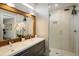 Modern bathroom with double vanity and walk-in shower at 3932 Quivas St, Denver, CO 80211