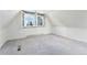 Bright bedroom with a large window and white shutters, providing plenty of natural light and scenic views at 9185 Jill Dr, Conifer, CO 80433