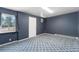 Bedroom features large windows, patterned floors, and neutral wall color at 9185 Jill Dr, Conifer, CO 80433