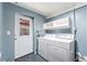 Laundry room includes a washer and dryer with access to the exterior at 9185 Jill Dr, Conifer, CO 80433