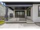 Cozy back porch featuring a black ceiling, sliding glass doors, and wrought iron railing at 1846 Chestnut Ave, Erie, CO 80516