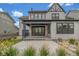 Expansive backyard featuring a covered porch, concrete patio, and gravel landscape, perfect for entertaining at 1846 Chestnut Ave, Erie, CO 80516