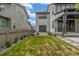 Lush backyard showcasing a green lawn, gravel accents, concrete patio, and detached garage at 1846 Chestnut Ave, Erie, CO 80516