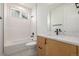 Modern bathroom features a tub and shower combination, and a stylish vanity at 1846 Chestnut Ave, Erie, CO 80516