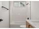 Bathroom featuring a bathtub, shower, and white tile at 1846 Chestnut Ave, Erie, CO 80516