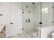 Contemporary bathroom featuring a glass-enclosed shower with white subway tile at 1846 Chestnut Ave, Erie, CO 80516