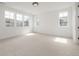 A bright bedroom featuring several windows and neutral walls and doors at 1846 Chestnut Ave, Erie, CO 80516