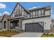 Beautiful two-story home showcasing a gray facade, well-manicured lawn, and an attached two-car garage at 1846 Chestnut Ave, Erie, CO 80516