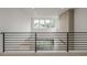 Second floor landing with modern black iron railings and clerestory windows at 1846 Chestnut Ave, Erie, CO 80516