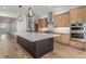 Modern kitchen featuring a large island, stainless steel appliances, and custom cabinetry at 1846 Chestnut Ave, Erie, CO 80516