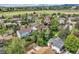Aerial view of a tranquil residential neighborhood featuring lush green spaces and well-maintained homes at 3265 W 11Th Avenue Ct, Broomfield, CO 80020