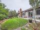 Beautiful backyard showcasing a well-kept lawn, mature trees, and patio with outdoor seating at 3265 W 11Th Avenue Ct, Broomfield, CO 80020