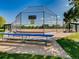 Well-maintained baseball field with fencing, seating, and clear signage at the ready at 3265 W 11Th Avenue Ct, Broomfield, CO 80020