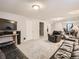 Finished basement with comfortable seating, television, and ample space for various activities at 3265 W 11Th Avenue Ct, Broomfield, CO 80020