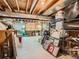 Unfinished basement space ideal for storage or a workshop, featuring exposed beams and concrete floors at 3265 W 11Th Avenue Ct, Broomfield, CO 80020