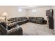 Finished basement featuring large sectional sofa and carpeted flooring at 3265 W 11Th Avenue Ct, Broomfield, CO 80020