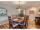 Cozy dining area featuring a classic wooden table with seating for six and neutral wall color at 3265 W 11Th Avenue Ct, Broomfield, CO 80020