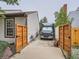 Driveway leading to the house, showing a vehicle parked within the property at 3265 W 11Th Avenue Ct, Broomfield, CO 80020