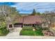 Charming exterior elevation showcasing a well-maintained lawn, mature trees, and a welcoming entrance at 3265 W 11Th Avenue Ct, Broomfield, CO 80020
