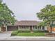 Charming single-story home with brick accents, manicured lawn, mature trees, and attached two-car garage at 3265 W 11Th Avenue Ct, Broomfield, CO 80020