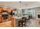 Modern kitchen with stainless steel appliances, granite counters, breakfast bar, and eat-in dining nook at 3265 W 11Th Avenue Ct, Broomfield, CO 80020