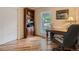 Office with built-in bookshelf, desk, and large window at 3265 W 11Th Avenue Ct, Broomfield, CO 80020