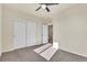 Bedroom with closet featuring sliding doors, neutral walls, and carpet flooring at 9002 Birch Run Dr, Parker, CO 80134