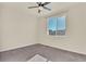 Bedroom with large window offering neighborhood views and a modern ceiling fan at 9002 Birch Run Dr, Parker, CO 80134