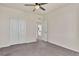 Bedroom with closet featuring sliding doors, neutral walls, and carpet flooring at 9002 Birch Run Dr, Parker, CO 80134