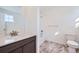 Clean bathroom, featuring a tub shower, toilet and vanity at 544 Twilight St, Erie, CO 80516