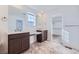 Bathroom with double vanity, and large walk-in closet at 544 Twilight St, Erie, CO 80516