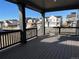 Covered patio with composite deck and view of neighborhood at 544 Twilight St, Erie, CO 80516