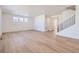 Bright living room with hardwood floors and staircase at 544 Twilight St, Erie, CO 80516