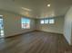 Spacious living room with hardwood floors and large windows at 544 Twilight St, Erie, CO 80516