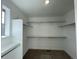 Large walk-in closet with double hanging rods and shelving at 544 Twilight St, Erie, CO 80516